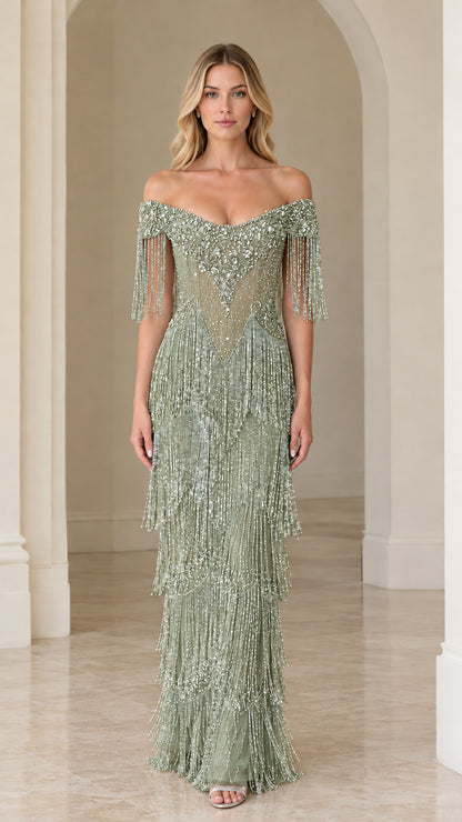Full-length view of woman wearing sage green off-the-shoulder beaded fringe evening gown