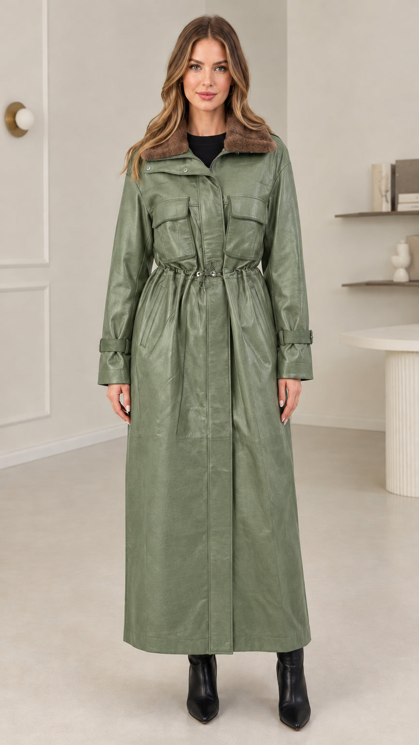 Full-length view of sage green faux leather maxi coat with utility pockets