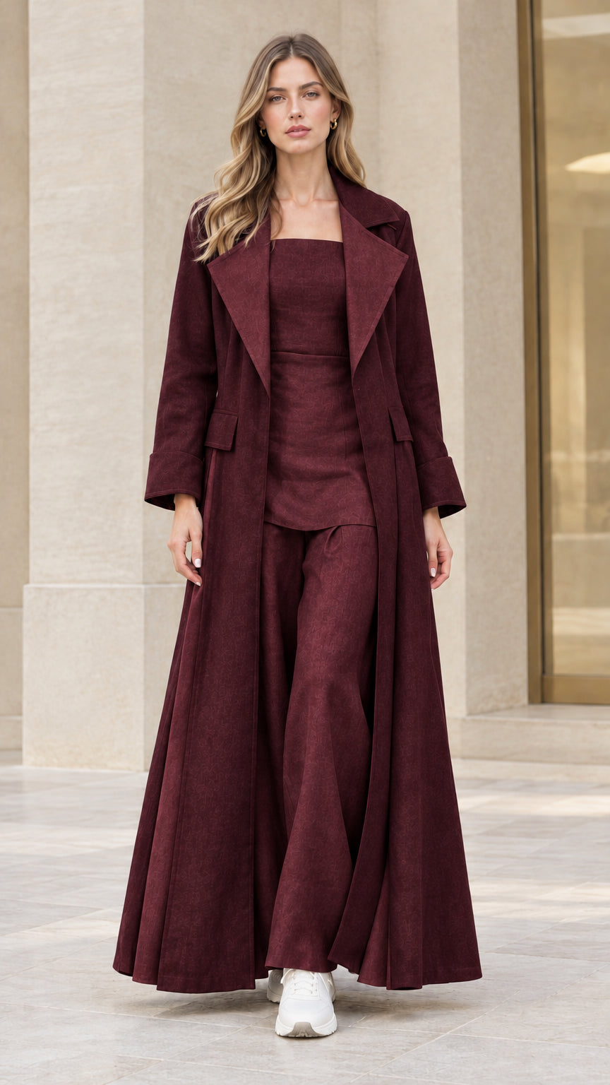 Front view of woman wearing burgundy wine colored maxi trench coat