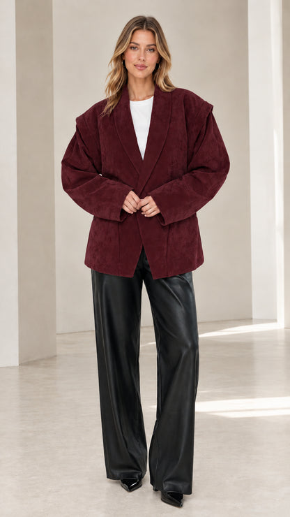 Front view of model wearing burgundy wine faux suede oversized tailored blazer