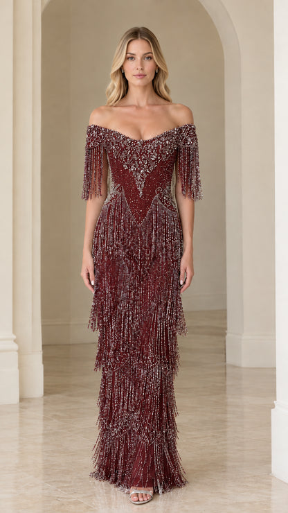Full-length view of woman wearing burgundy wine red off-the-shoulder beaded fringe evening gown