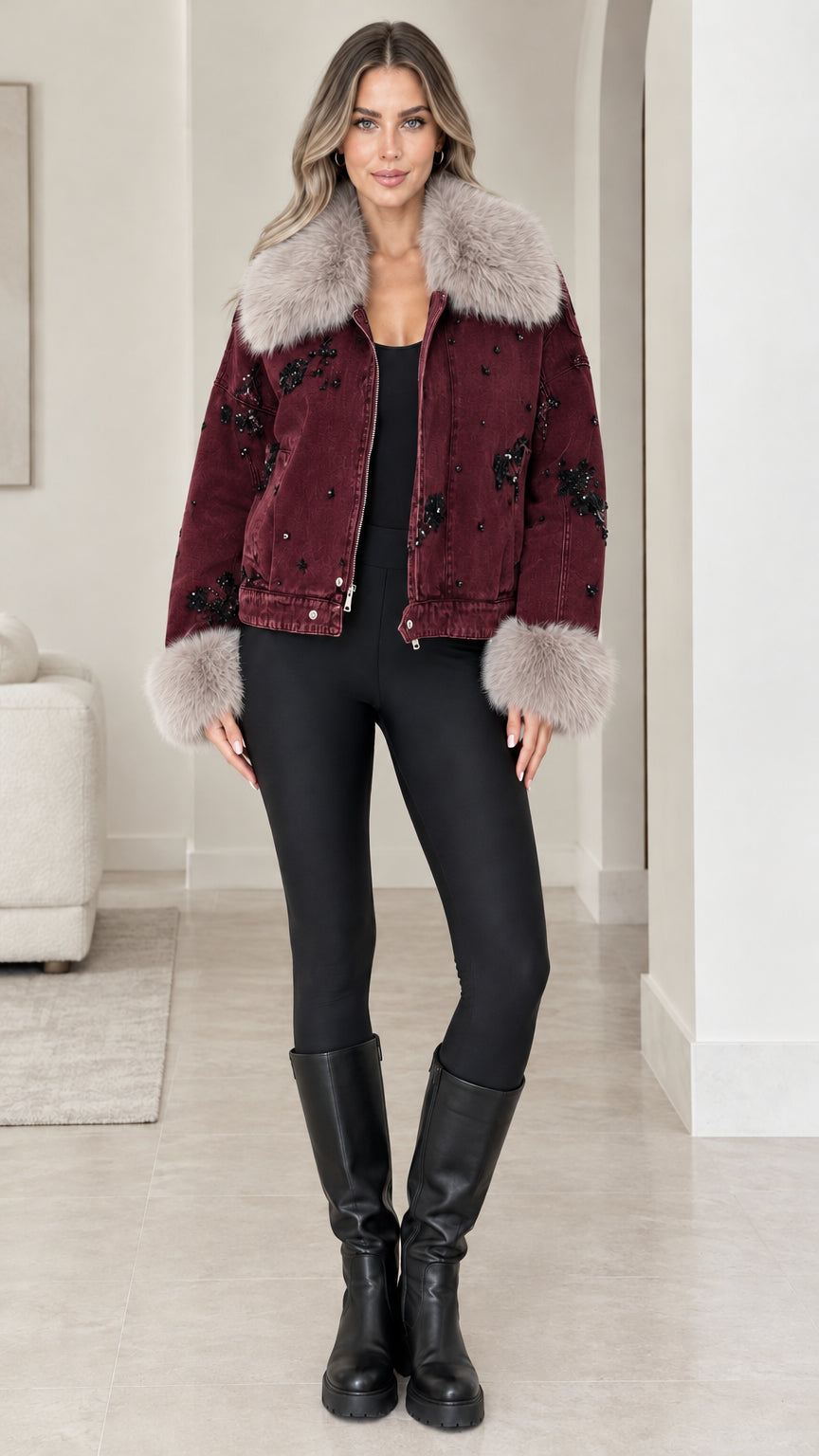 Front view of model wearing Burgundy embellished denim jacket with faux fur collar