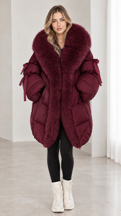 Model wearing burgundy wine red faux fur hooded quilted puffer coat