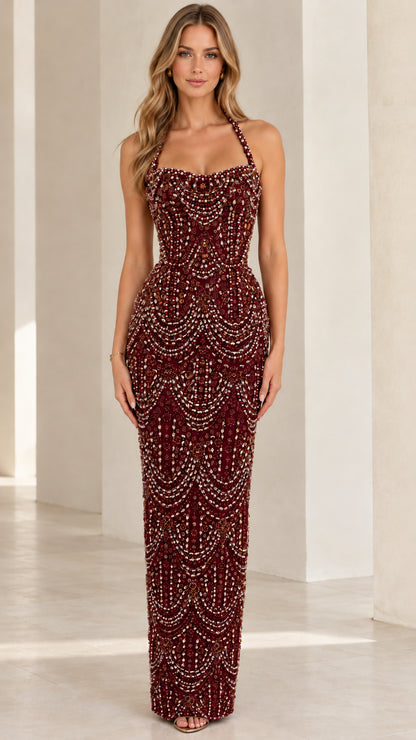 Full-length burgundy wine beaded halter evening gown on model