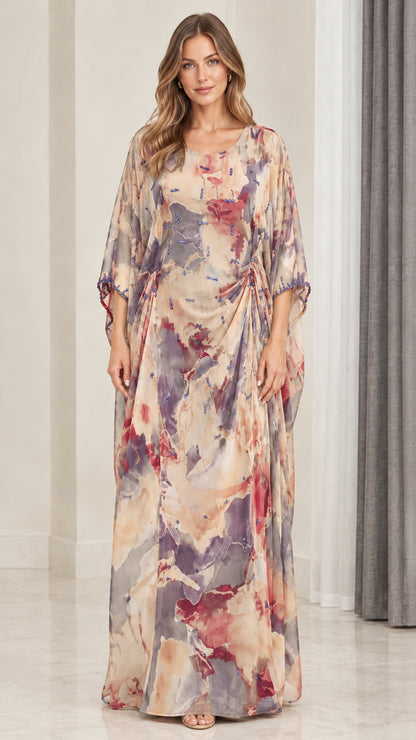 Front view of model wearing champagne multi watercolor draped kaftan maxi dress