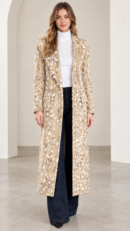 Front view of woman wearing beige speckled tailored maxi coat