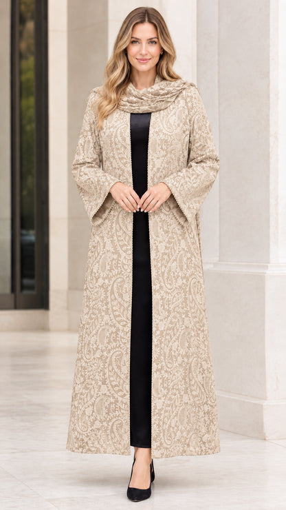 Front full-length view of woman wearing champagne beige paisley jacquard maxi duster coat