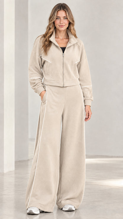 Front view of woman wearing beige contrast piping wide leg tracksuit set