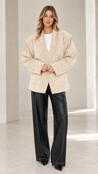 Front view of model wearing beige cream faux suede oversized tailored blazer