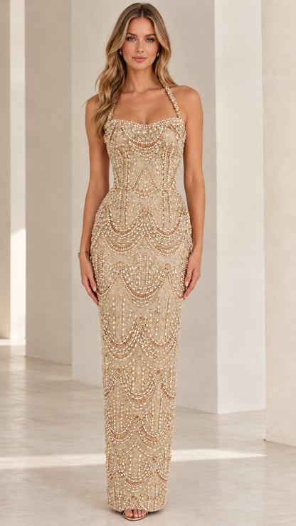 Full-length champagne gold beaded halter evening gown on model