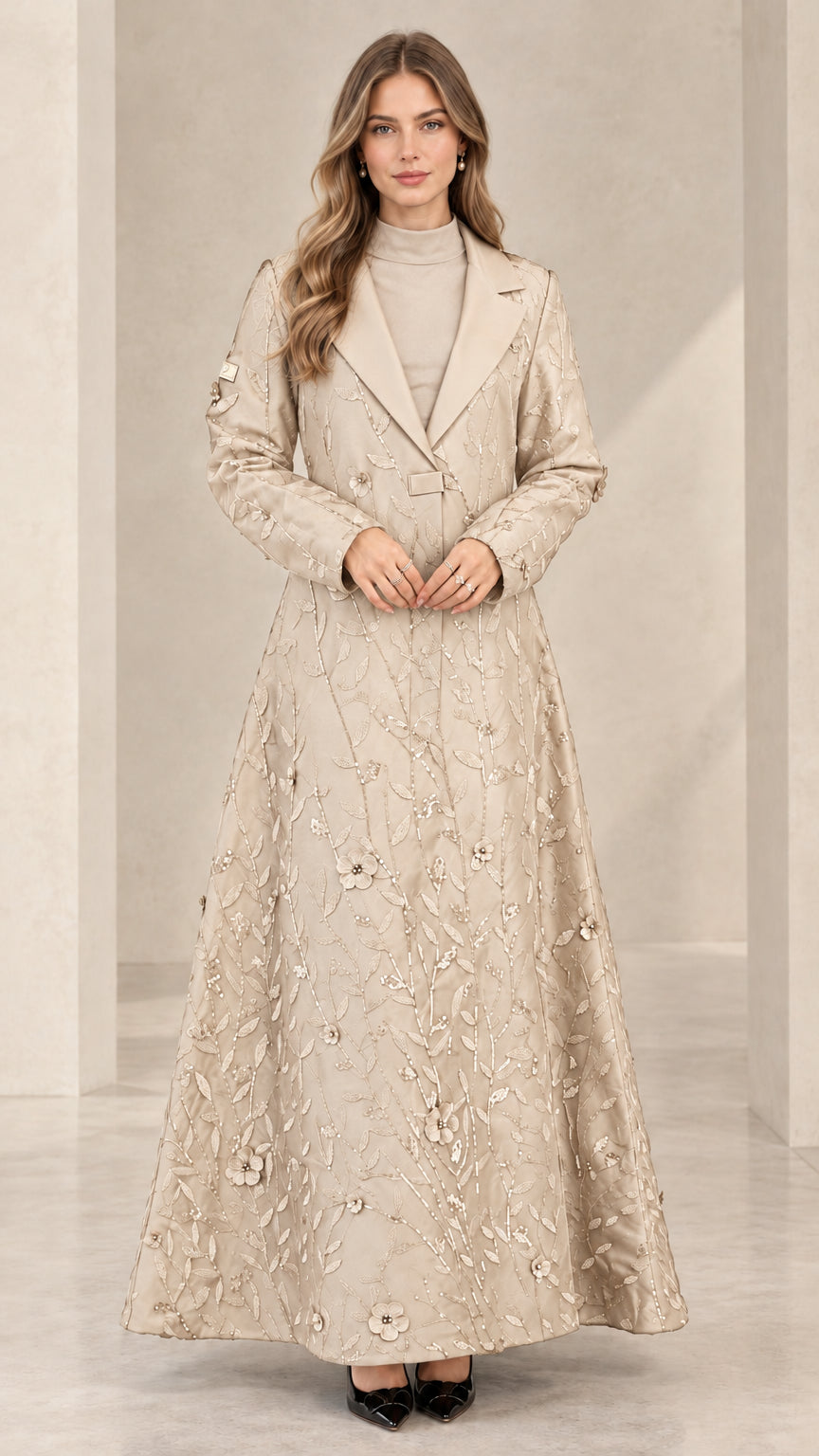 Front view of woman wearing champagne floral sequin maxi evening coat