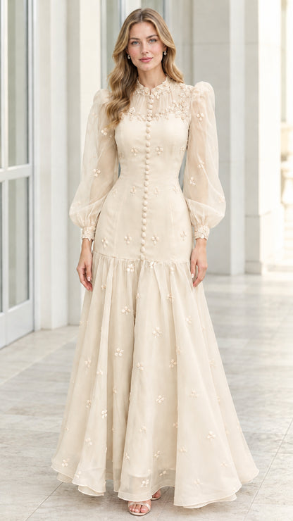 Front view of champagne cream sheer long sleeve floral embroidered formal dress